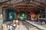 Diesel locomotives inside the barn and a CNW Cab car 